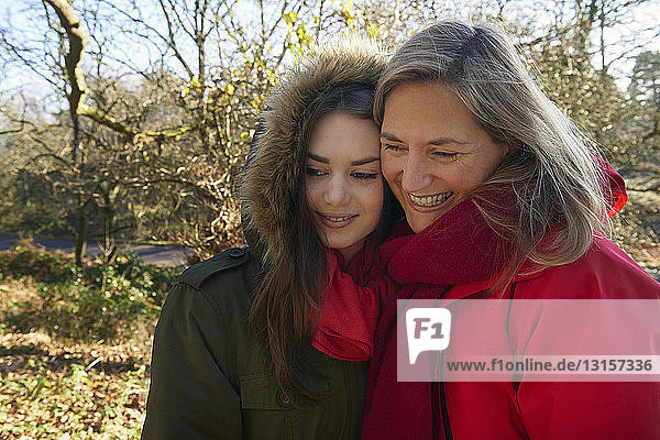 Portrait of mother and daughter  outdoors