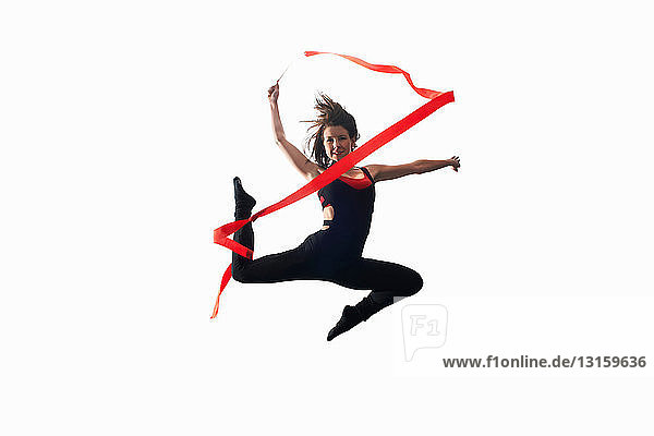 Dancer with ribbon on white background