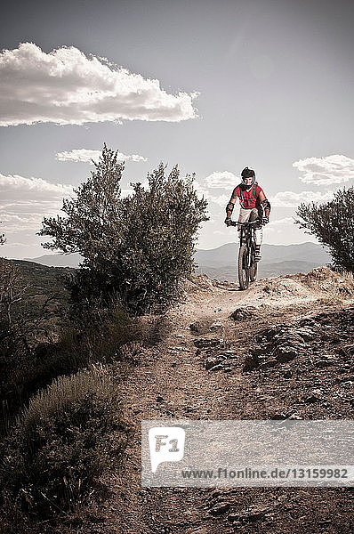 Mountain biker on rocky path