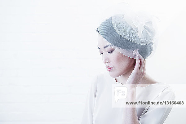 Woman wearing beanie hat indoors