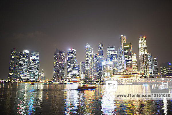 Night view of skyscrapers on waterfront  Singapore