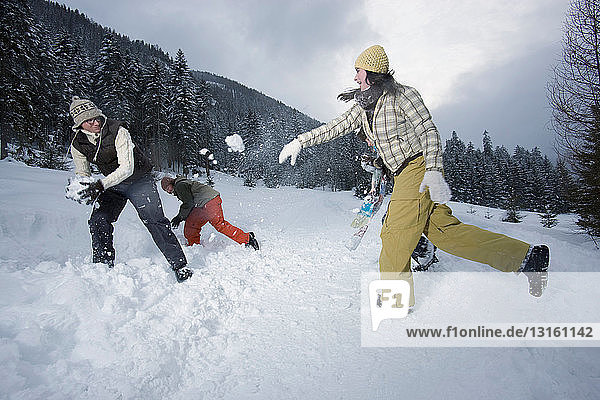 Teenagers in a snowball fight