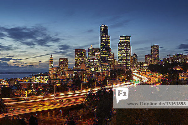 Highway and skyline at night  Seattle  Washington State  USA