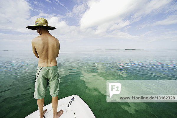 Young man standing on boat  Islamorada  Florida Keys  USA