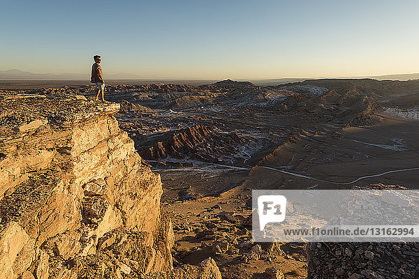 Man on cliff  Valle de la Luna (Valley of the Moon)  Atacama Desert  El Norte Grande  Chile