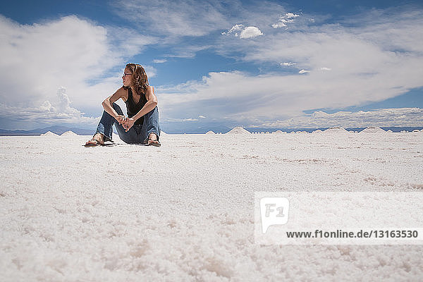 Woman sitting in salt field  Argentina  Salinas Grandes  Cordoba Province  Argentina