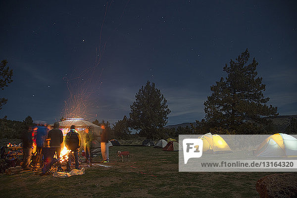 People around campsite fire  Smith Rock State Park  Oregon  US