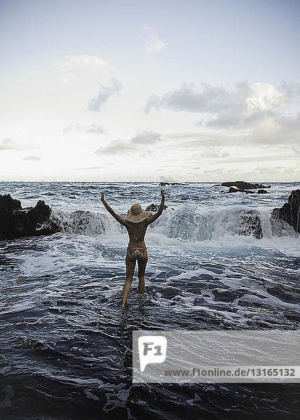Young woman paddling in sea  Hana  Maui  Hawaii