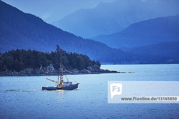 Fishing boat at dusk Juneau Alaska USA