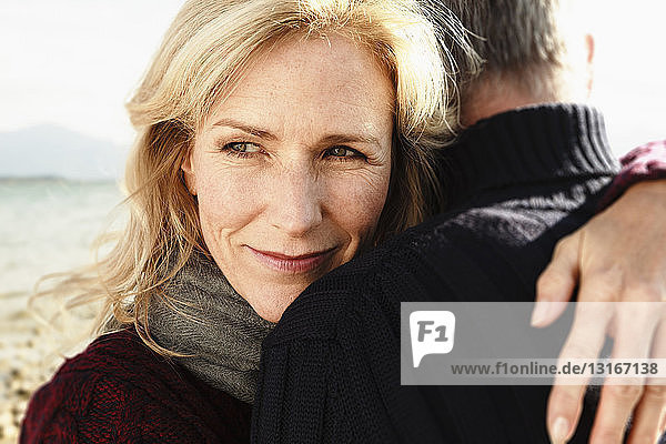 Mature couple outdoors  hugging  close-up