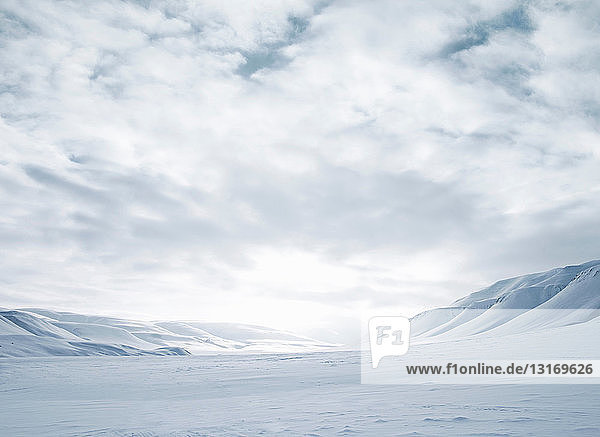 Mountains and snow-covered field
