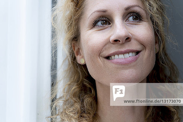 Portrait of smiling woman with brown eyes