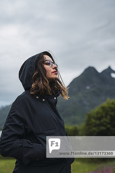Portrait of a woman wearing hooded jacket  outdoors
