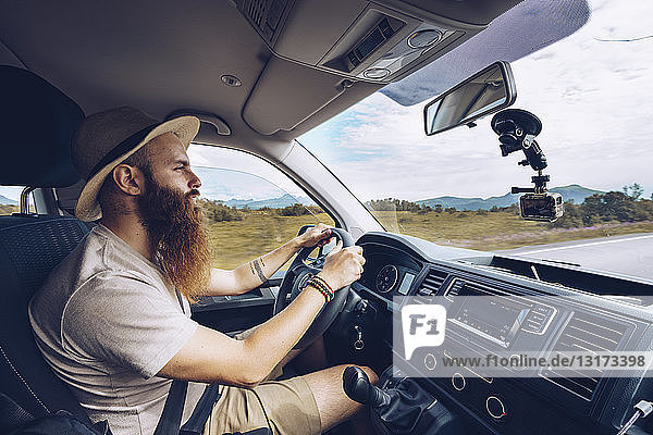 Norway  Lofoten  bearded man driving