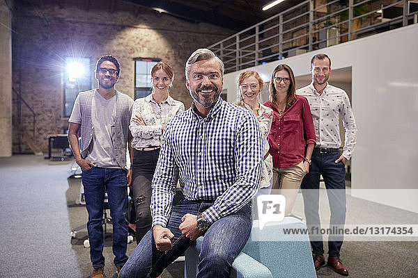 Group portrait of a team of colleagues working for a start up company
