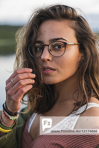 Portrait of beautiful young woman wearing glasses
