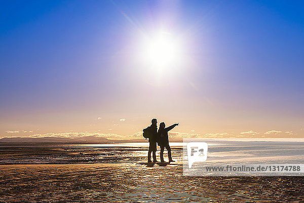 Great Britain  Scotland  Solway Firth  silhouette of mature couple
