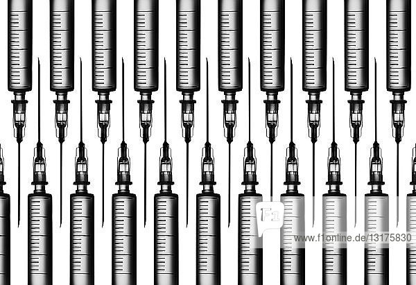 Multiple syringes organized in a pattern over white background