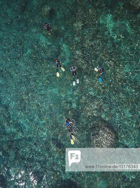 Indonesia  Bali  Divers in ocean at Amed beach