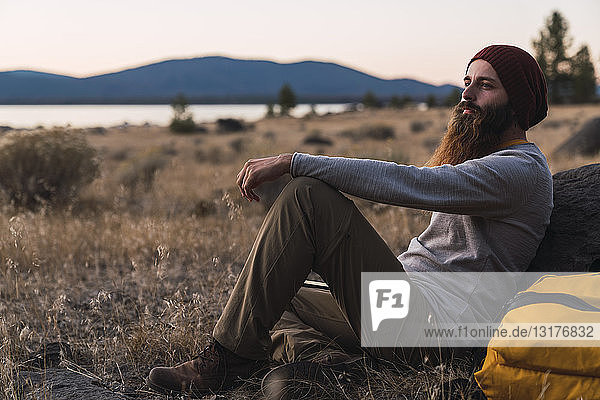 USA  North California  bearded young man having a break on a hiking trip near Lassen Volcanic National Park