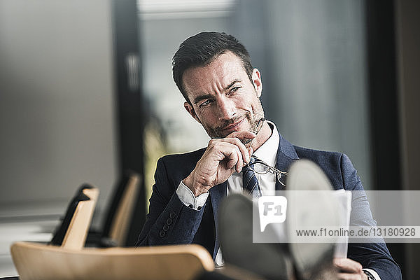 Businessman reading documents  thinking