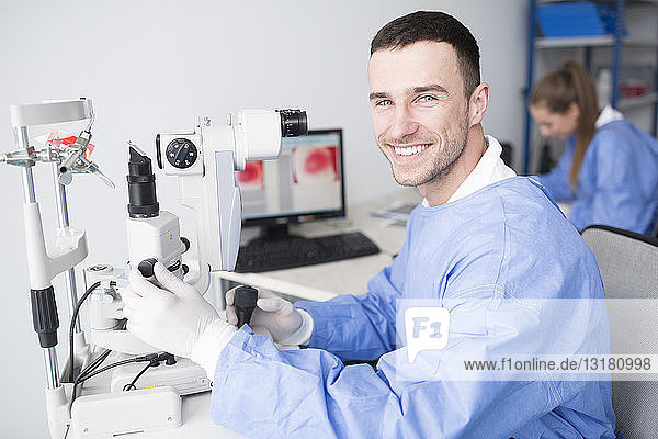 Portrait of smiling lab technician in lab