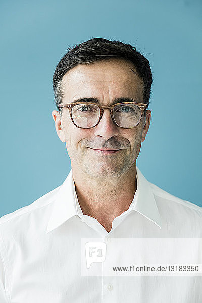 Portrait of confident businessman wearing glasses