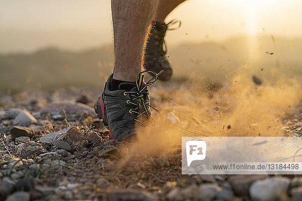Close-up of feet of a trail runner