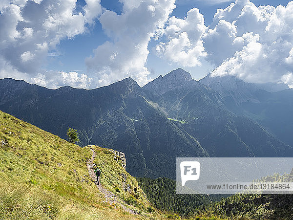 Italy  Lombardy  Valle di Scalve  hiker on hiking trail  Mount Camino