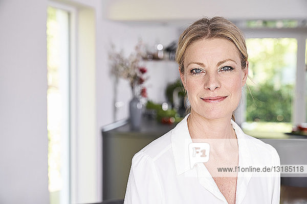 Portrait of confident woman at home