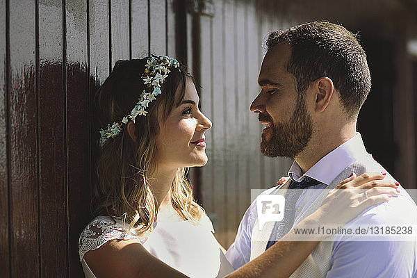 Bridal couple enjoying romantic moments in front of a beach hut