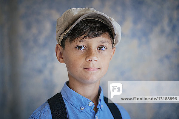Portrait confident boy wearing cap