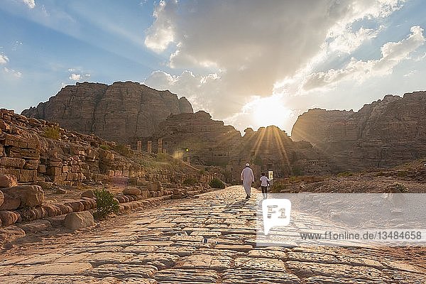 Two locals walk on Old Roman Road next to ruins of Petra  Nabataean city of Petra  near Wadi Musa  Jordan  Asia