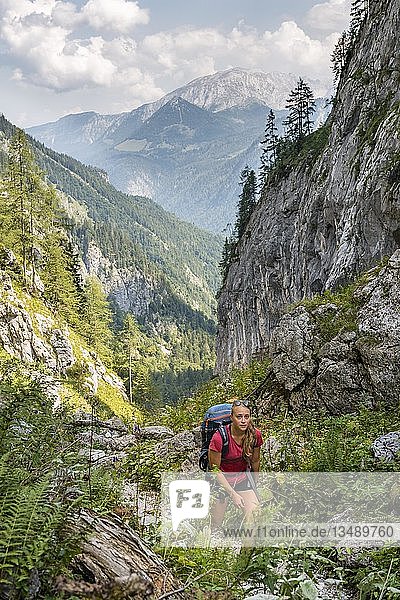 Female hiker on a hiking trail  view of mountains  Saugasse  hiking trail to KÃ¶nigssee and KÃ¤rlinger Haus  Berchtesgaden National Park  Bavaria  Germany  Europe