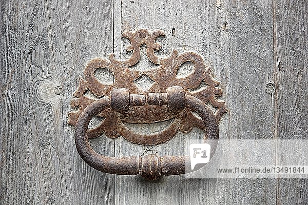 Knocker on an old wooden door  Arta  Llevant  Majorca  Balearic Islands  Spain  Europe