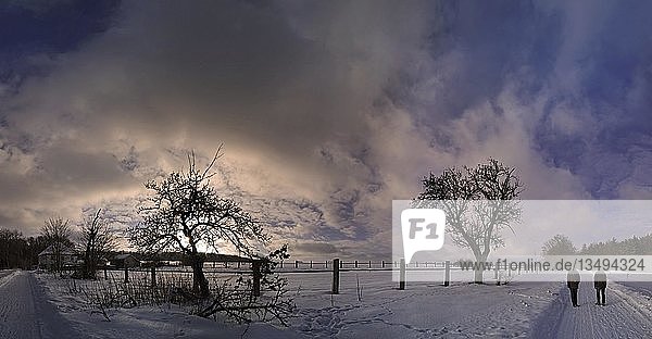 Winter landscape with hikers at sunset  Eichstaett  Bavaria  Germany  Europe