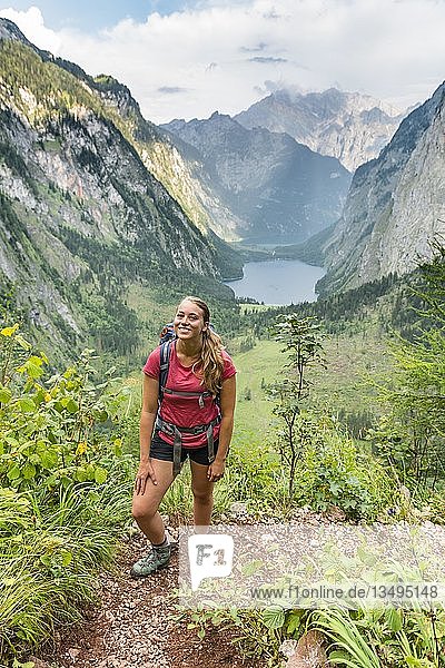View of Obersee and KÃ¶nigssee  young hiker on the RÃ¶thsteig  behind Watzmann  Berchtesgaden  Upper Bavaria  Bavaria  Germany  Europe