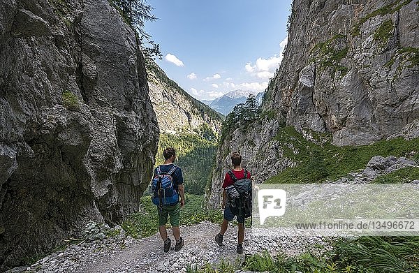 Two hikers on hiking trail to KÃ¤rlingerhaus  Saugasse  KÃ¶nigssee  National Park Berchtesgaden  Berchtesgadener Land  Upper Bavaria  Bavaria  Germany  Europe