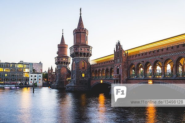 Oberbaum Bridge with underground between Kreuzberg and Friedrichshain at sunset Spree Berlin Germany Europe