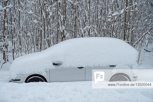 Snowed-in car  Munich  Upper Bavaria  Bavaria  Germany  Europe