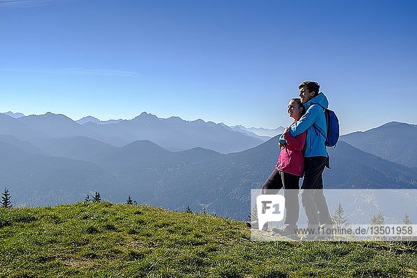 Young couple enjoying the view  hiker at HÃ¶rndle  HÃ¶rnle  Zeitberg  near Bad Kohlgrub  Ammergauer Alps  Upper Bavaria  Bavaria  Germany  Europe