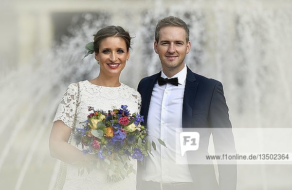 Bridal couple in front of a fountain  Stuttgart  Baden-WÃ¼rttemberg  Germany  Europe
