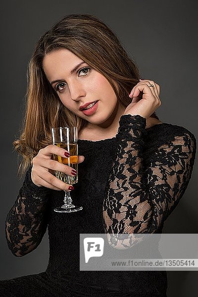 Portrait of a young woman with champagne glass