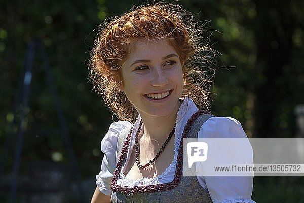 Girl with braided hairstyle and dirndl  Upper Bavaria  Bavaria  Germany  Europe