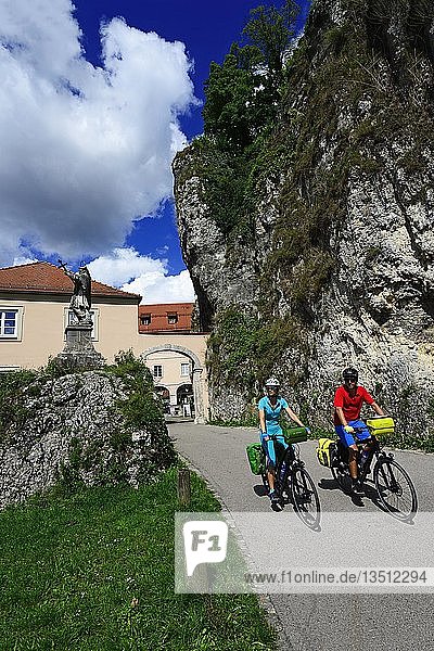 Cyclists in front of the monastery Weltenburg  Eastern Bavaria  Lower Bavaria  Bavaria  Germany  Europe