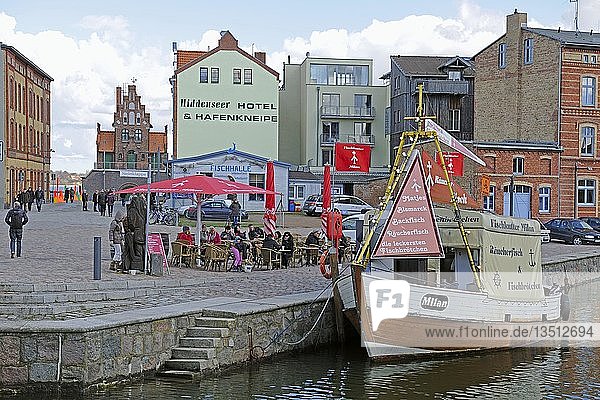 Fishing cutter selling fresh fish and fish bread-rolls in Querkanal  a canal in the historic port of Stralsund  Mecklenburg-Western Pomerania  Germany  Europe  PublicGround  Europe