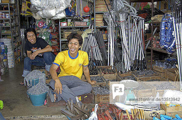 Youg people in their shop on a market in pak chong in thailand