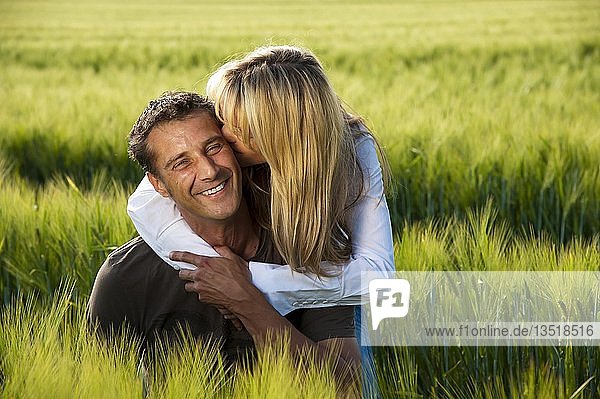 Couple in love in a corn field