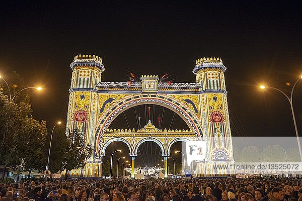 Colorful illuminated entrance portal at night  opening act of illumination el Alumbrao  Spring Festival Feria de Abril  Sevilla  Andalusia  Spain  Europe