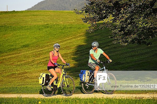 Cyclists on the Mozart Cycle Route  Chiemgau  Upper Bavaria  Germany  Europe